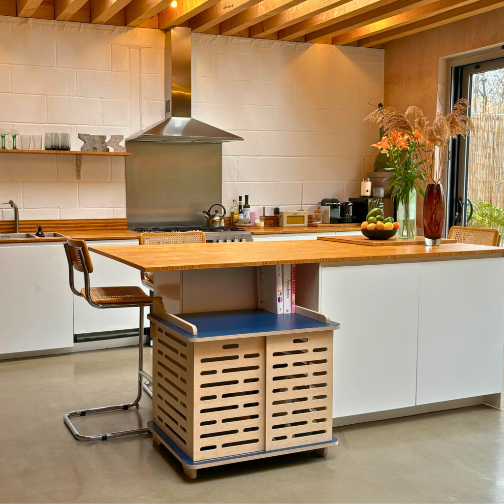 Tame blue dog crate in kitchen setting